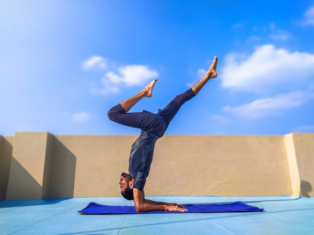 Men practicing power yoga outdoors